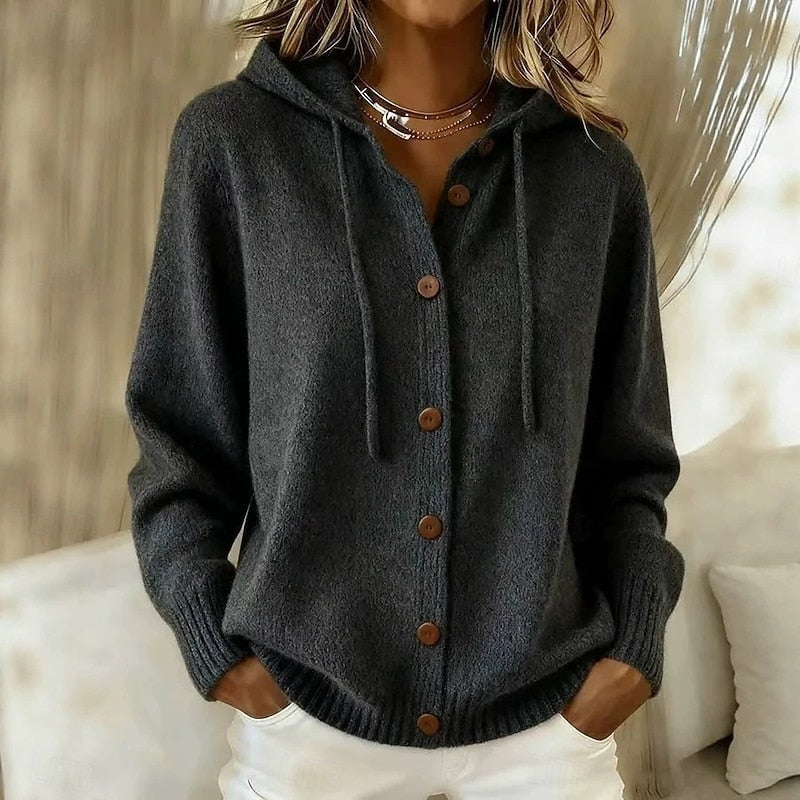 Black hooded button-front cardigan with drawstrings, long sleeves and pronounced ribbed cuffs and hem.