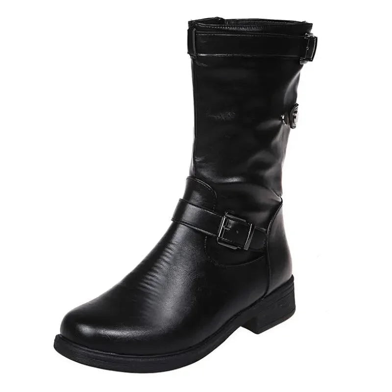 Single black mid-calf biker boot on a white background with a low heel, rounded toe, ankle buckle, and upper strap.