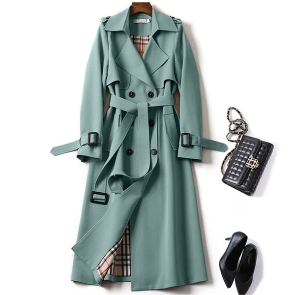 Sage green trench coat featuring a defined belted waist, overlapping double-breasted front, checked lining at the opening, and buckled cuffs.