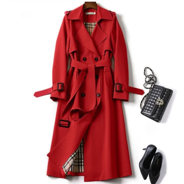 Red long trench coat presented with a tied waist belt, double-breasted button front, wide lapels, and buckled sleeve straps.