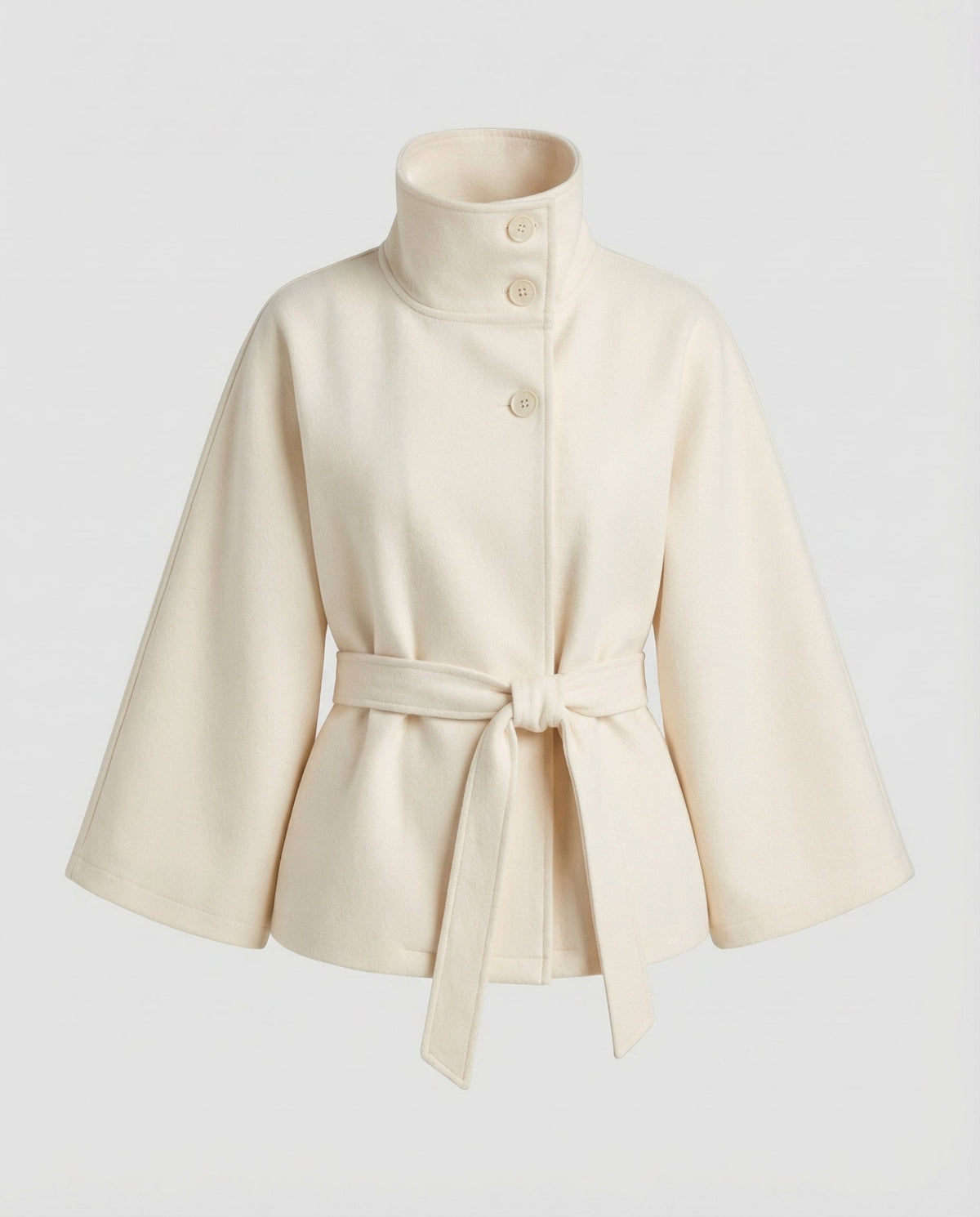 Ivory version of the jacket showing its buttoned stand collar, wide sleeves, and knotted waist tie.