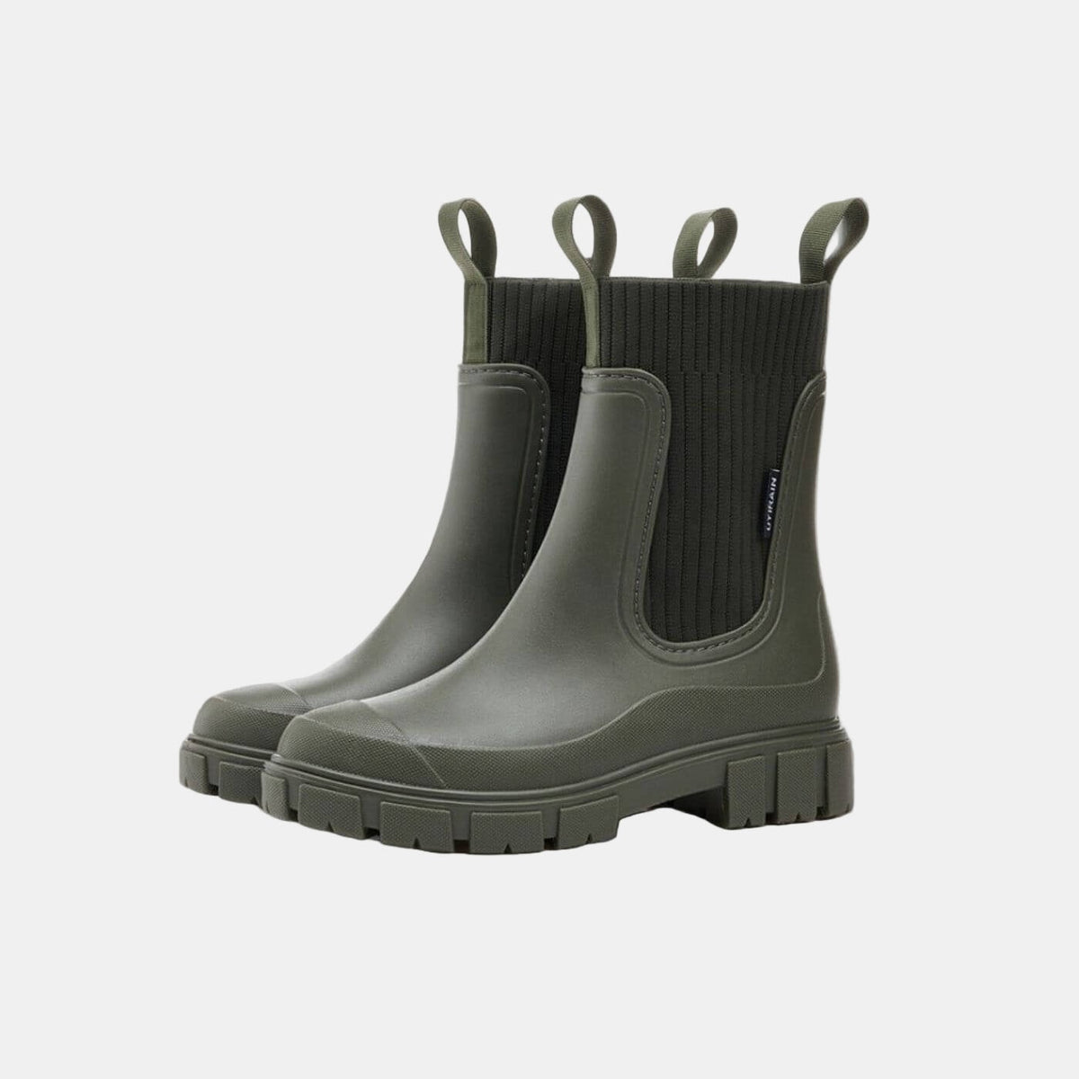 Pair of dark olive Chelsea boots with ribbed elastic side panels, pull tabs, rounded toes, and chunky treaded soles.