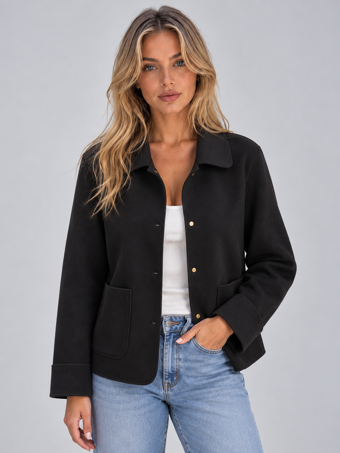 Front view of the black overshirt jacket with a wide collar, button front, and two patch pockets.