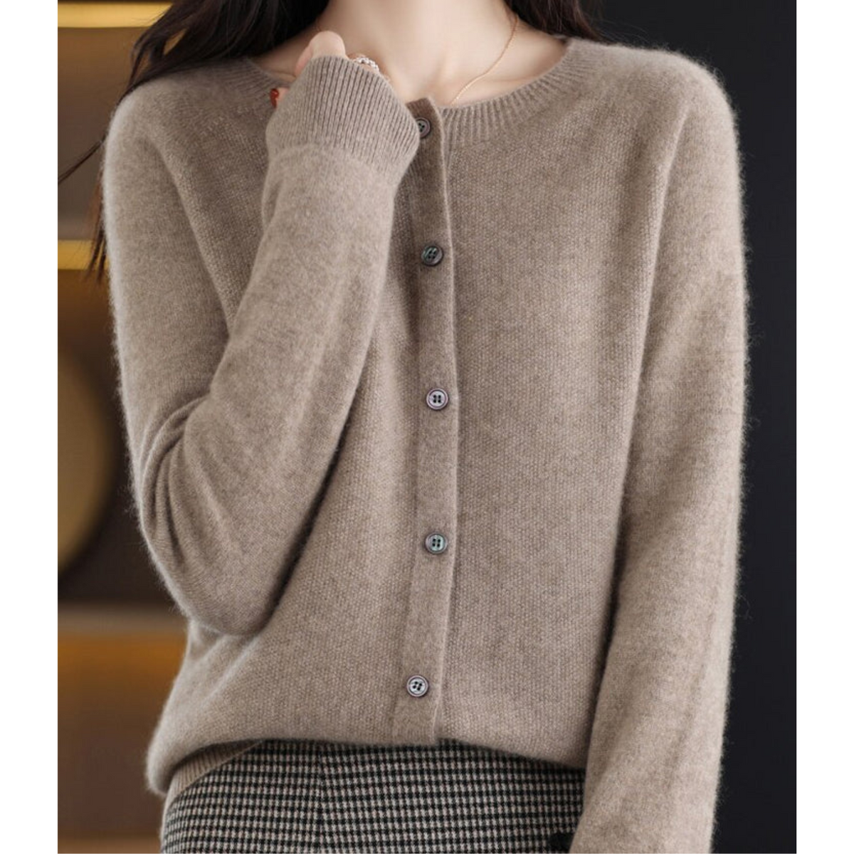 Taupe cardigan paired with a checked skirt