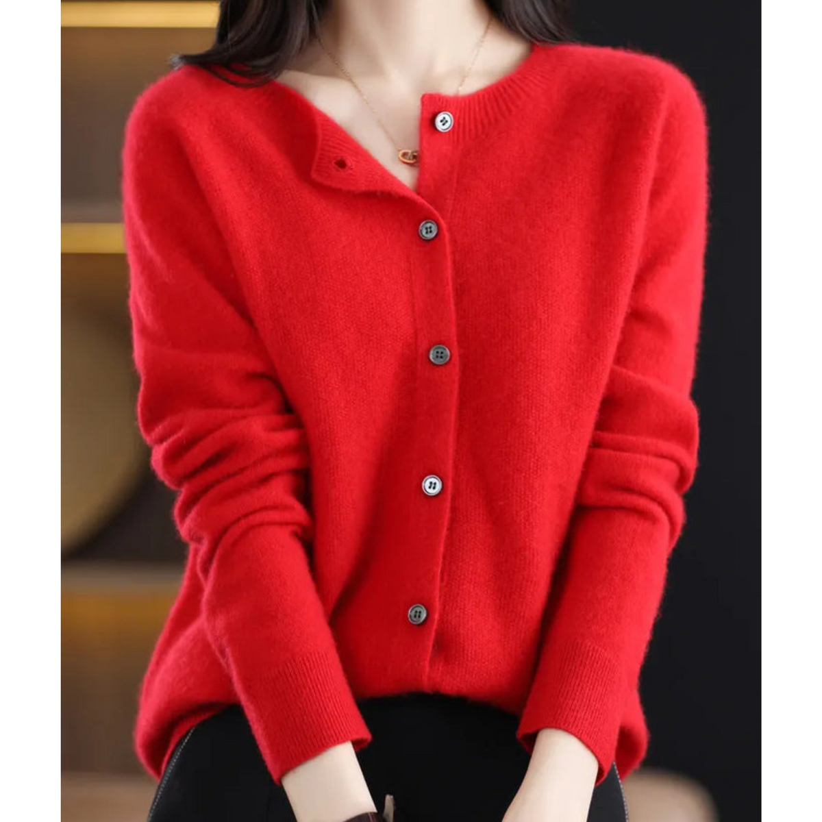 Red crew neck cardigan with gathered long sleeves and a buttoned front