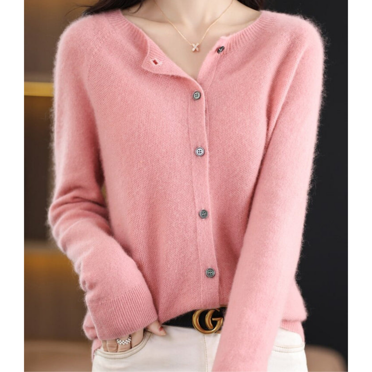 Light pink long-sleeve cardigan with ribbed cuffs and a buttoned front