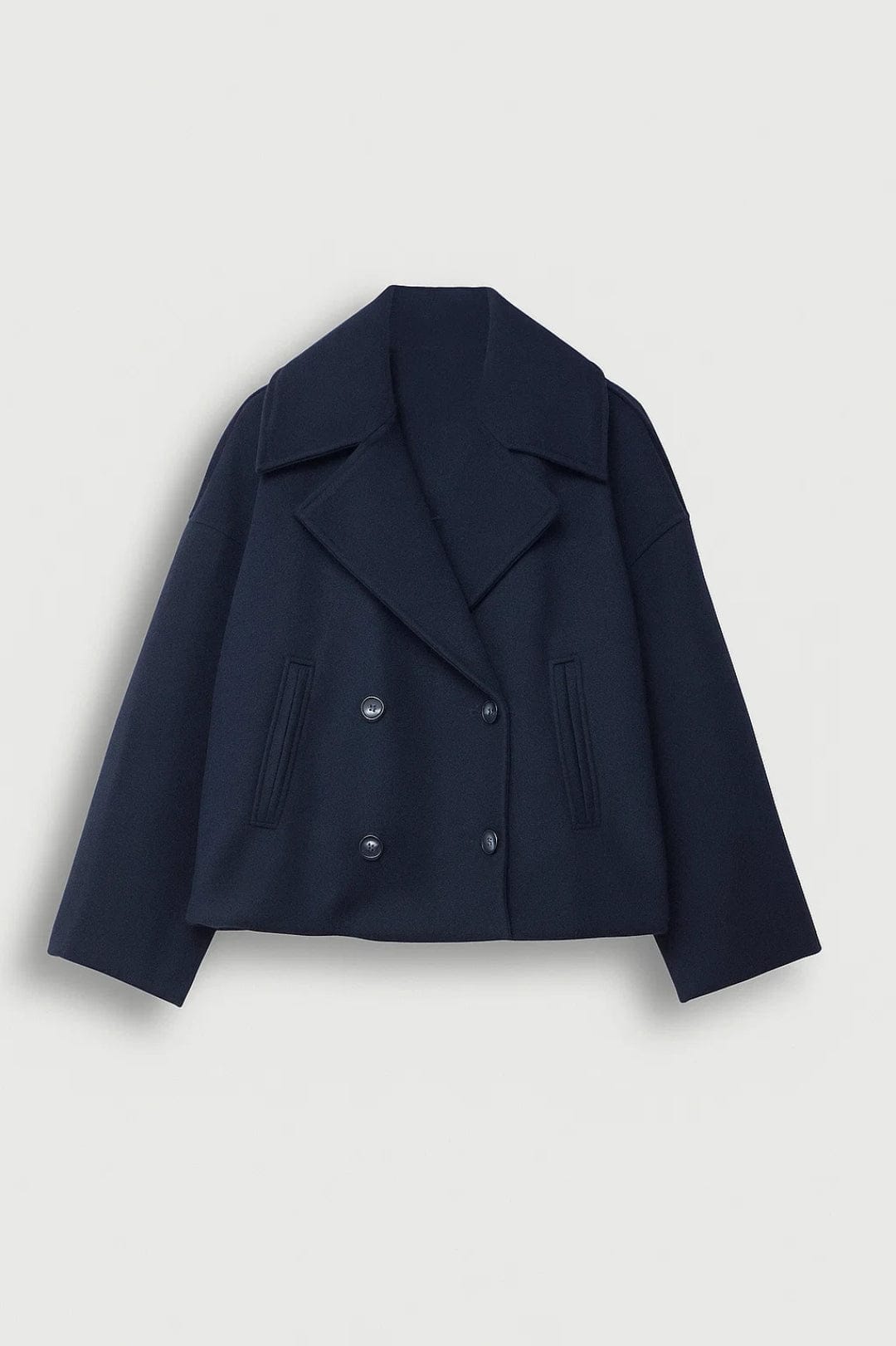 Cropped double breasted coat with wide notched lapels, four front buttons, welt pockets and dropped shoulder long sleeves._0