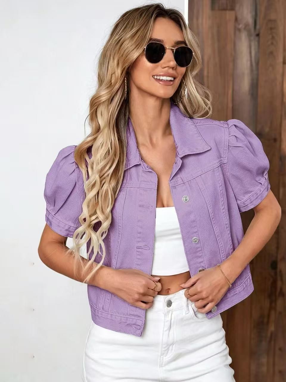 Lavender cropped jacket featuring gathered puff sleeves, a pointed collar, chest pockets, and a visible button front.