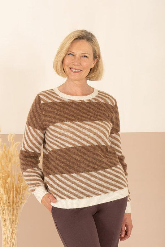 Woman wearing a long sleeve crew neck jumper with wide diagonal stripes and ribbed neck, cuffs and hem, with trousers._0