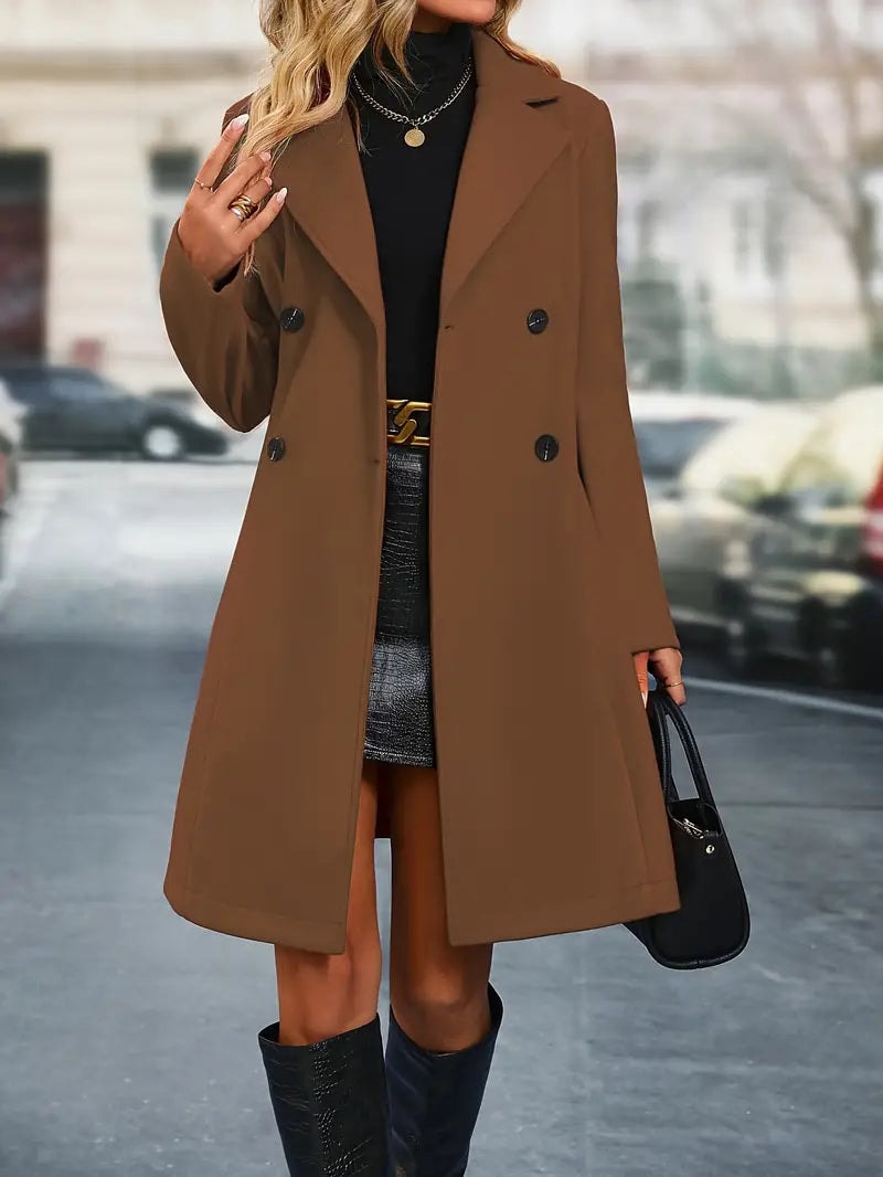 Brown double-breasted trench coat worn open, showing its long sleeves, notched lapels, and knee-length hem.