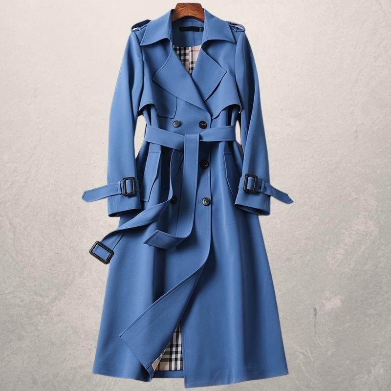 Blue belted trench coat with double-breasted buttons, wide lapels, buckled cuffs, and a partially open front.