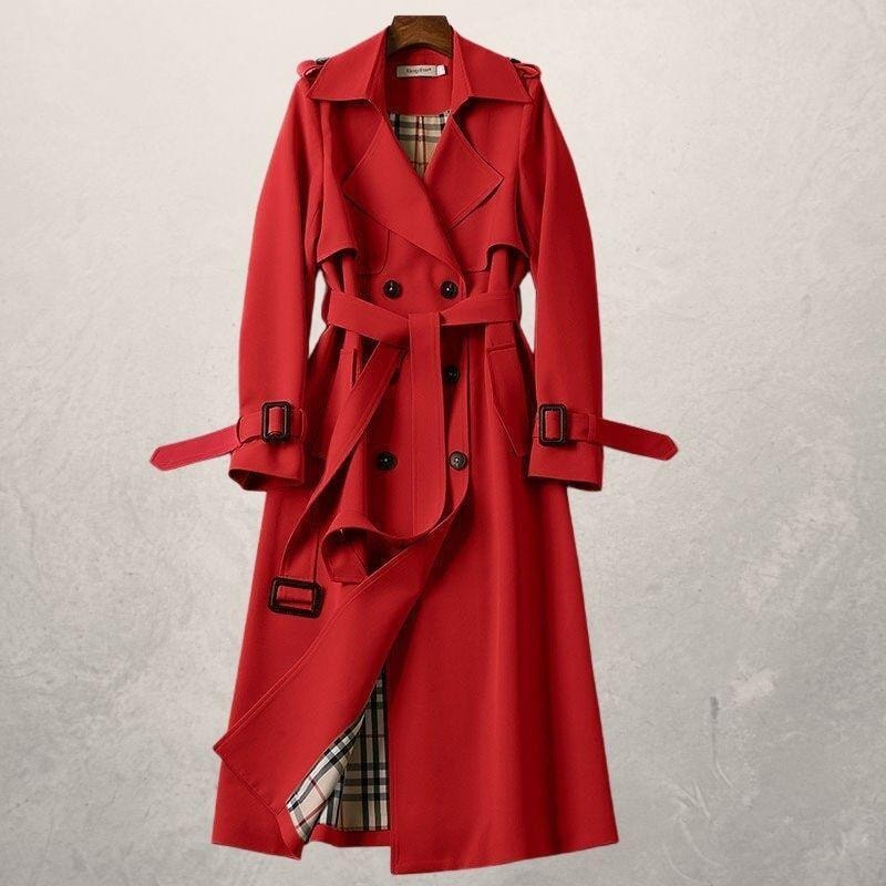 Bright red belted trench coat with wide lapels, double-breasted buttons, buckled cuffs, and checked lining at the opening.