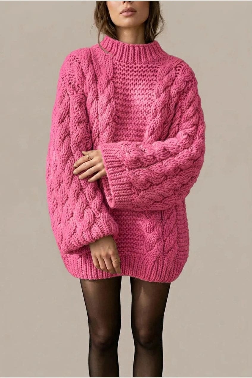 Model wearing an oversized chunky cable knit mock neck sweater dress with wide turn back cuffs and a ribbed hem, styled with sheer tights._1