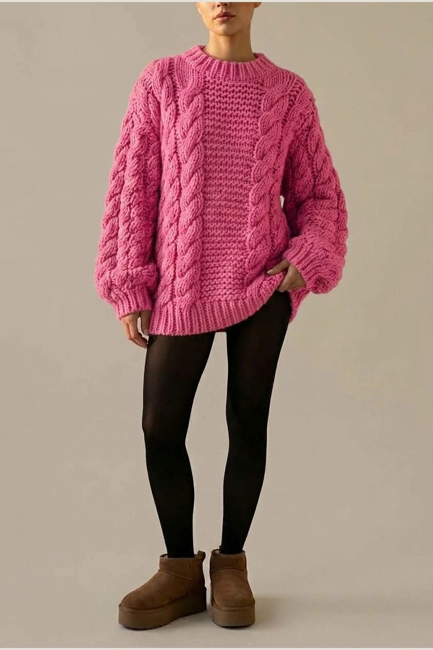 Model wearing an oversized chunky cable knit mock neck sweater dress with wide turn back cuffs and a ribbed hem, styled with sheer tights._2