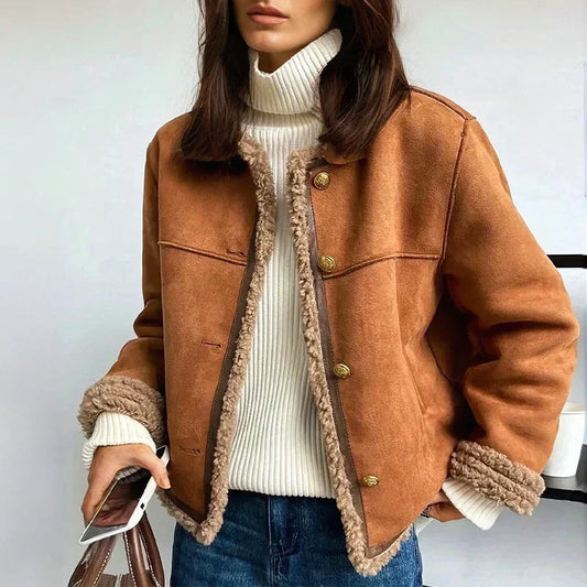 Front view of a rich brown jacket with plush shearling trim along the open front, collar, cuffs and hem, styled with gold-tone buttons.