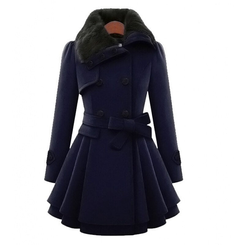 Front three-quarter view of the coat in deep navy, highlighting the black faux-fur collar, structured double-breasted front, belted waist, and flowing flared skirt.