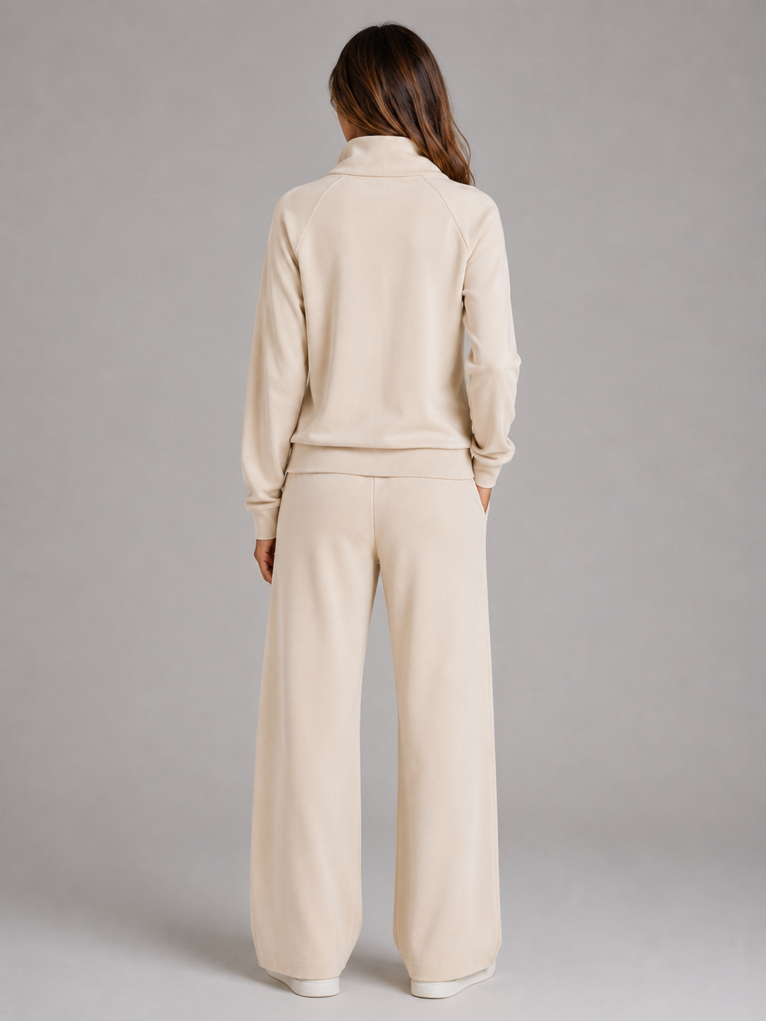 Back view of the beige matching lounge set, showing the sweatshirt back and relaxed wide-leg trousers.