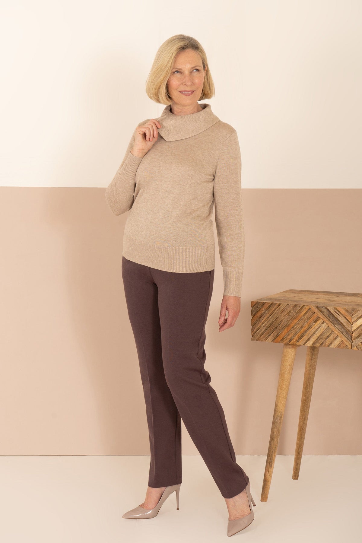 Woman wearing a long sleeve fine knit jumper with a draped cowl neck, ribbed cuffs and hem, with a printed midi skirt._7