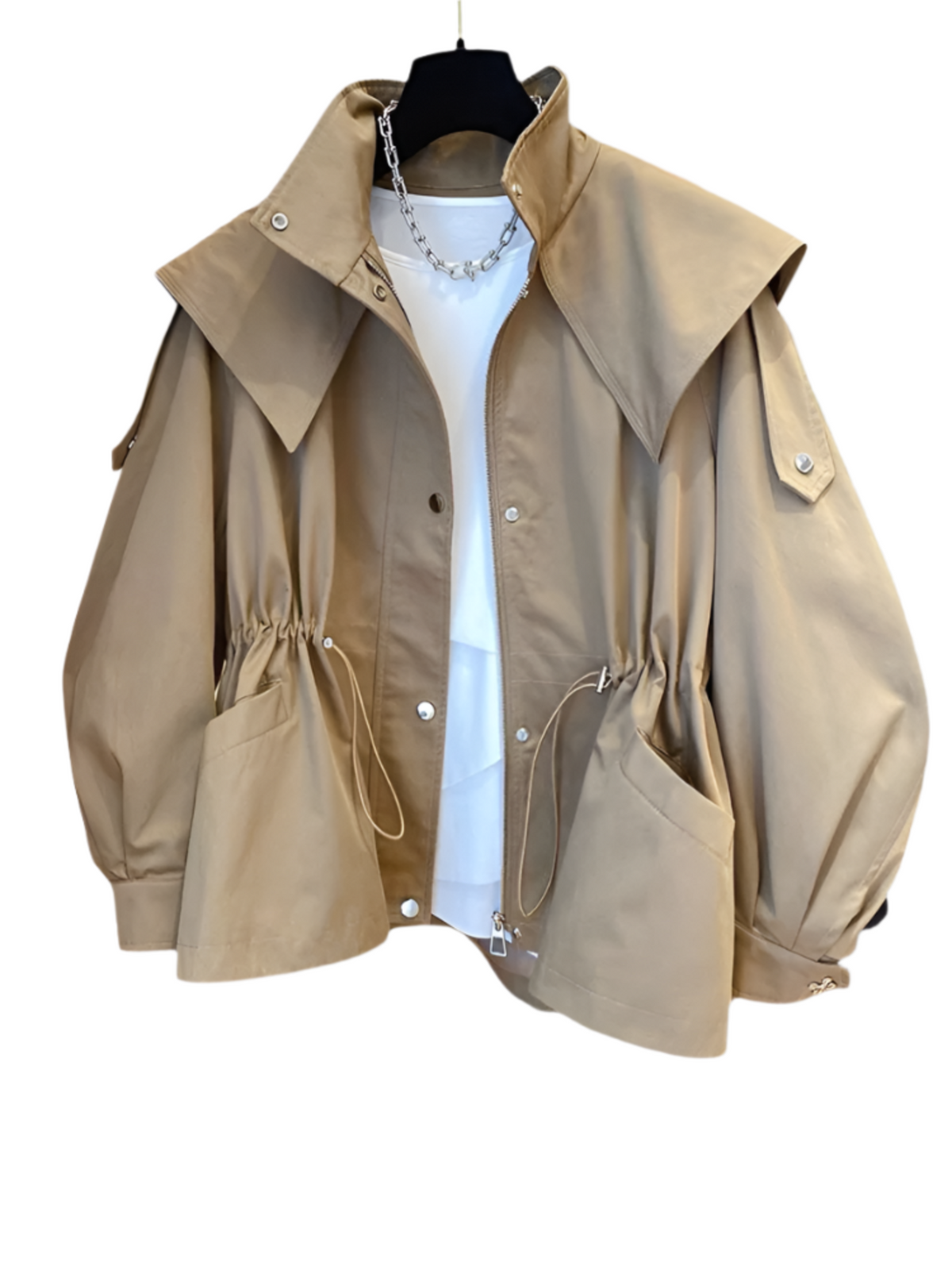 Front view of the beige hooded jacket against a plain background, showing its loose silhouette, wide collar, adjustable waist, and large front pockets.