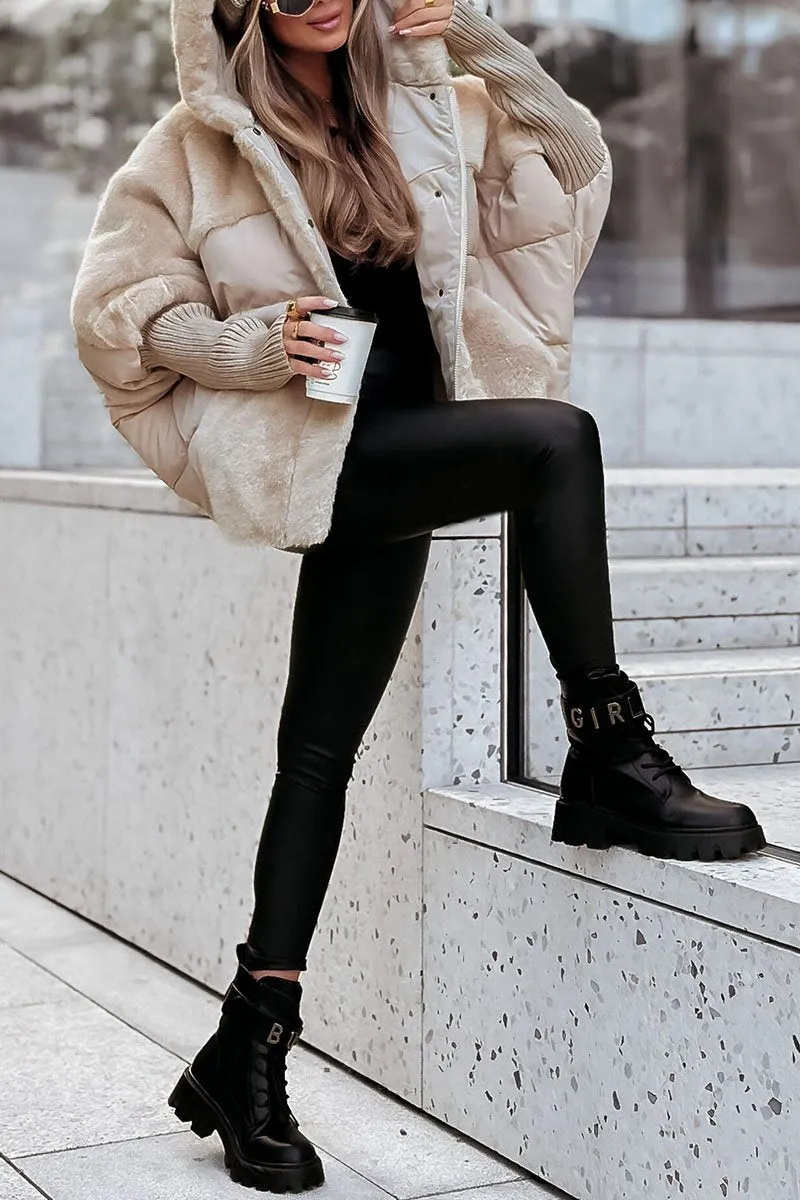 Cream hooded puffer jacket styled for an outdoor look, with plush panels, quilted sleeves, and an open front.