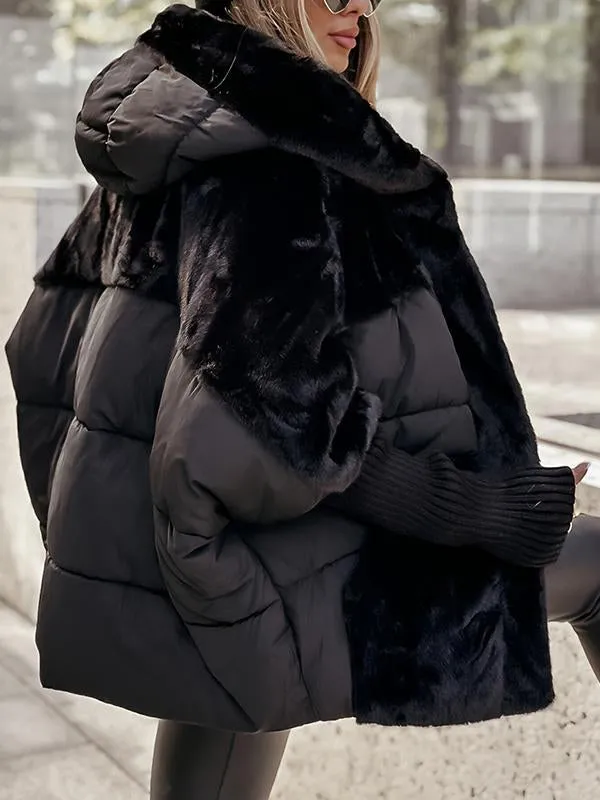 Rear three-quarter view of the black hooded puffer jacket, emphasizing its quilted back and plush fur side panels.