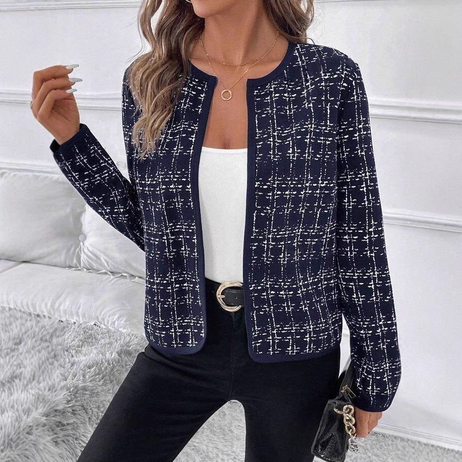 Navy jacket featuring a light contrast check pattern, open front, rounded collarless neckline, and long sleeves.