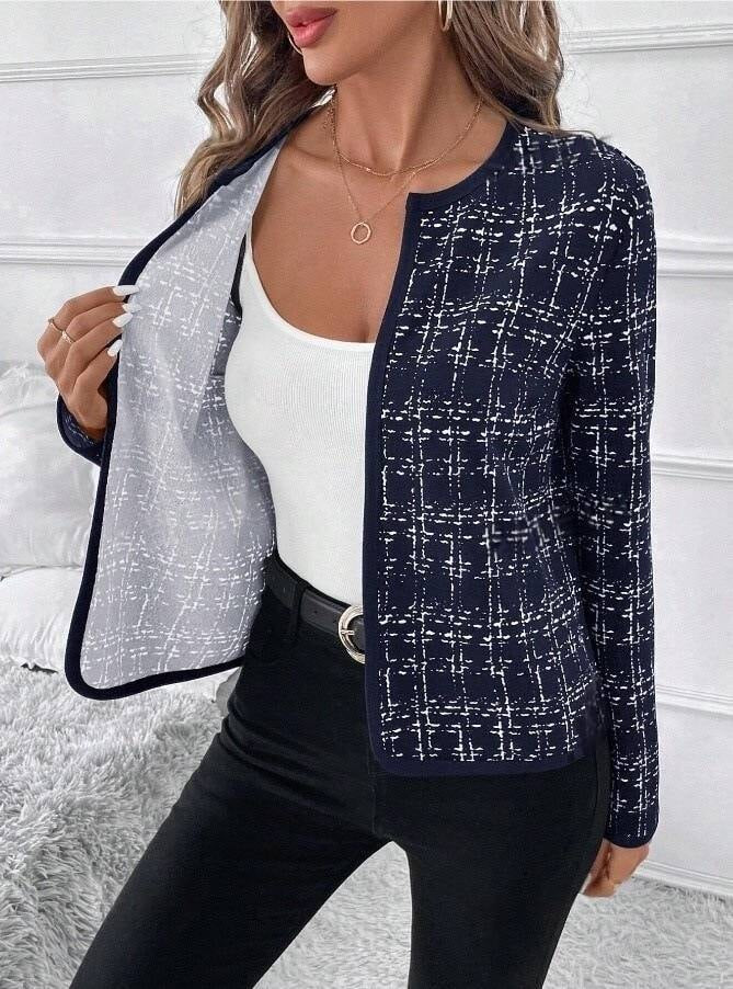 Navy contrast-check jacket opened to reveal its light interior, with a rounded collarless neckline and long sleeves.