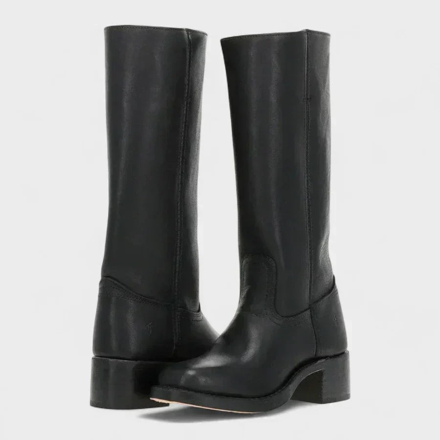 Pair of black knee-high boots with rounded toes, visible side seams, and sturdy block heels shown at an angled front view.