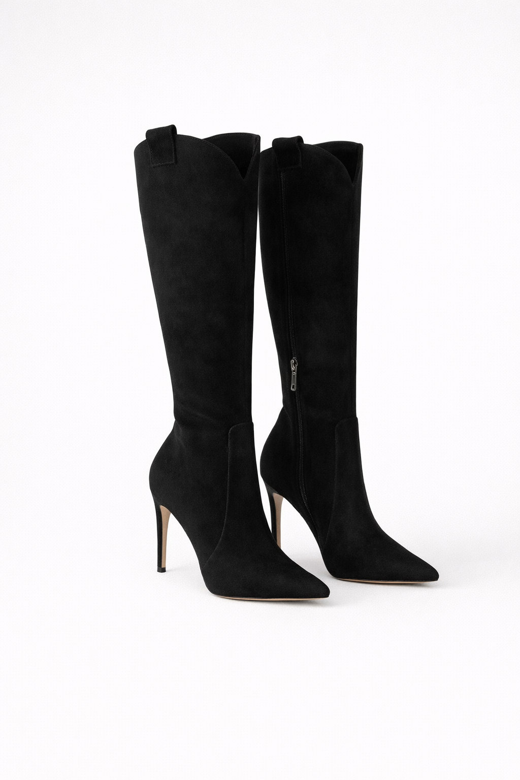 Black knee-high boots with a soft matte finish, pointed toes, and tall stiletto heels shown from a slightly angled view.