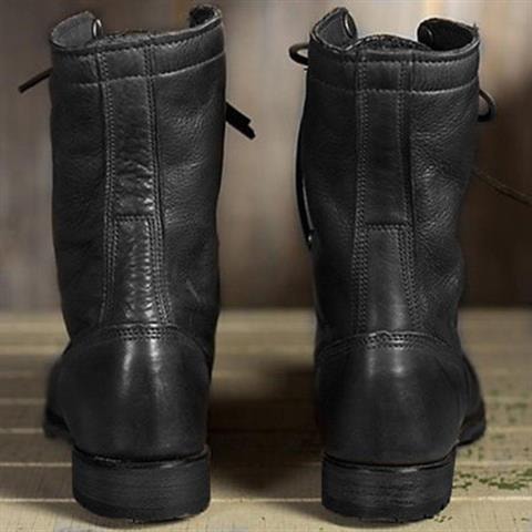 Black lace-up boots shown from the back, highlighting their ankle-height shafts, stitched panels, and low sturdy heels.