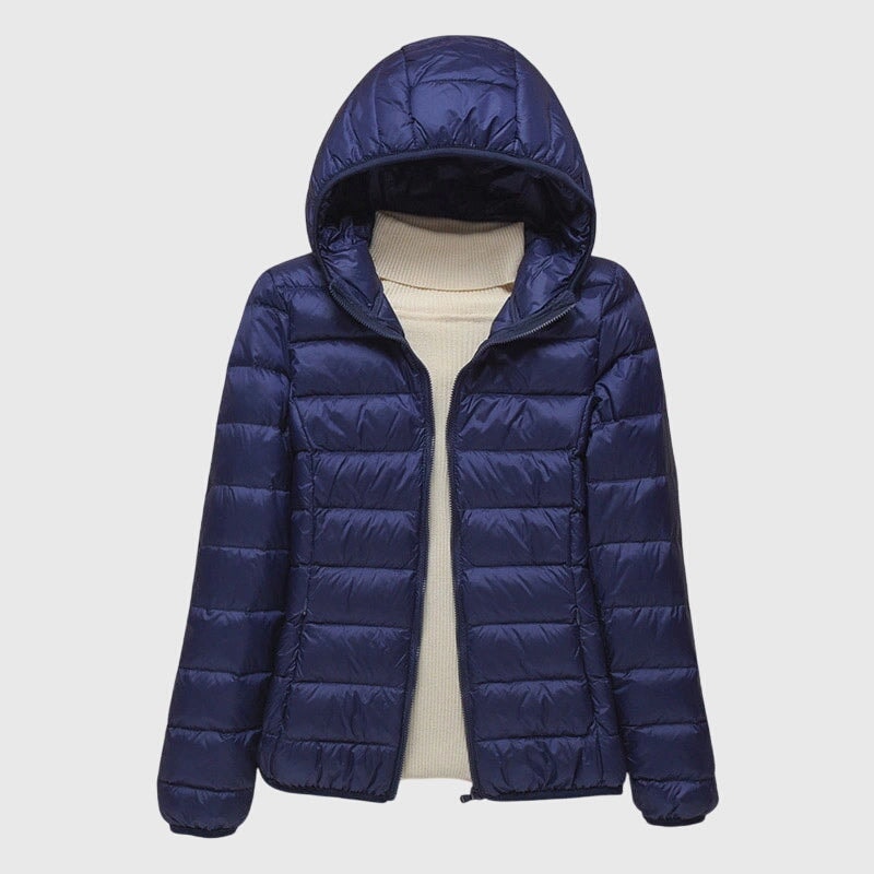 Navy blue lightweight puffer jacket displayed open with a large attached hood and long sleeves.