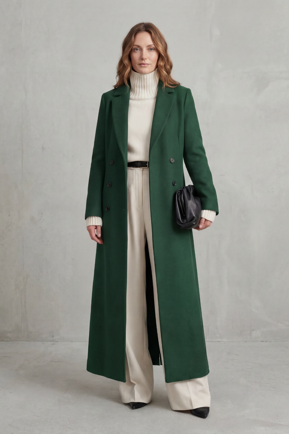 Dark green tailored coat shown straight on, displaying its long clean lines and symmetrical button arrangement.