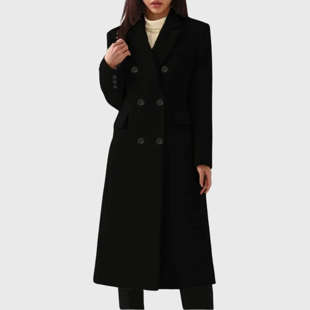 Black long tailored coat featuring a double-breasted front, sharp notched lapels, defined shoulders, and front flap pockets.