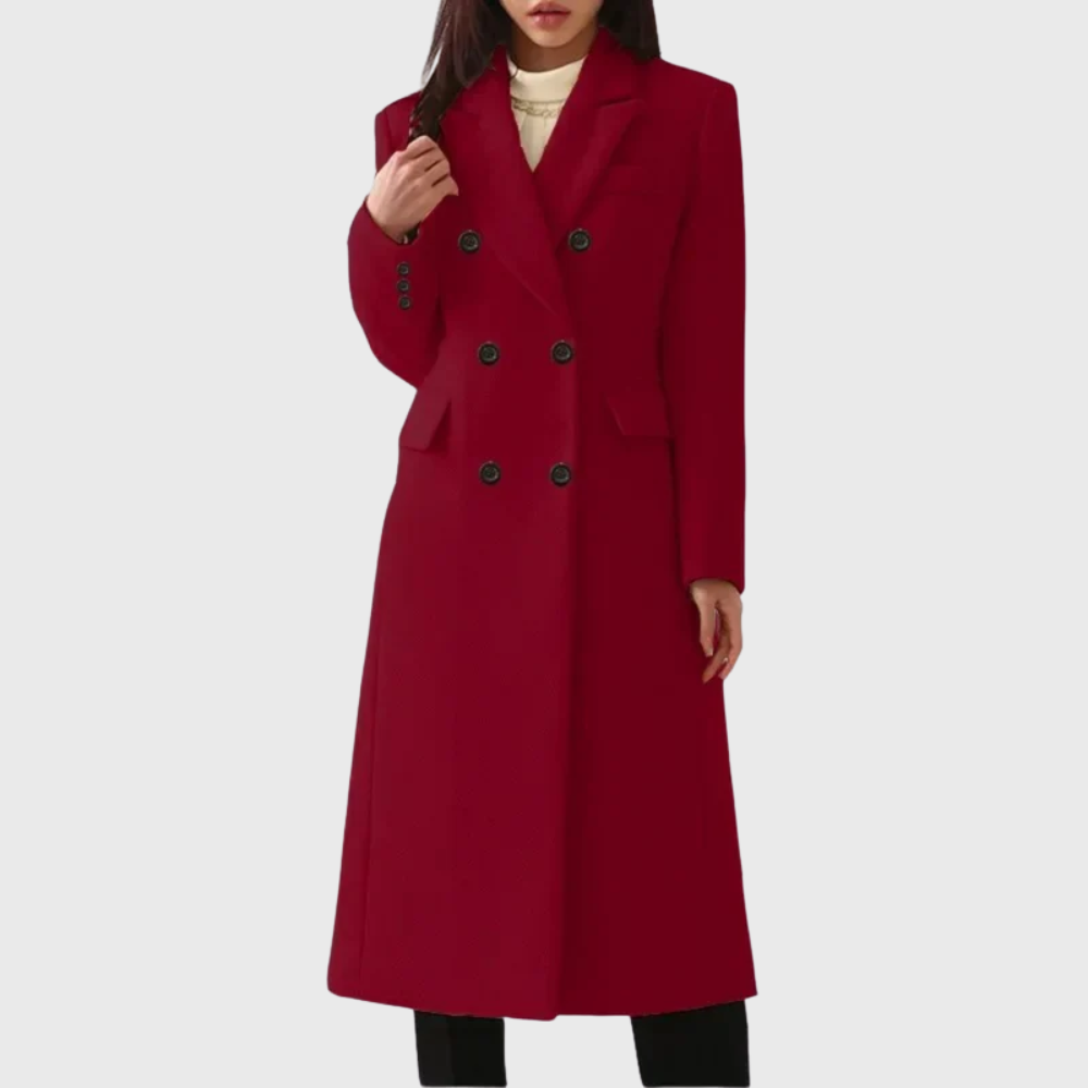 Deep red double-breasted coat with a long clean silhouette, notched lapels, structured shoulders, and flap pockets.