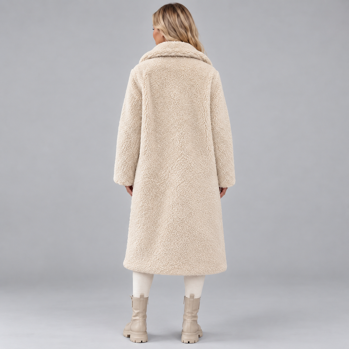 Back view of the cream long faux fur coat, showing its straight long silhouette, wide collar, and full-length sleeves.