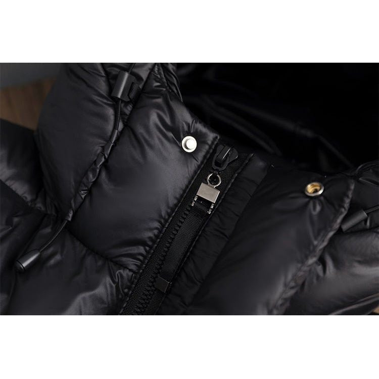 Close-up of the jacket’s front placket with zipper, snap fasteners, and adjustable strap detail.