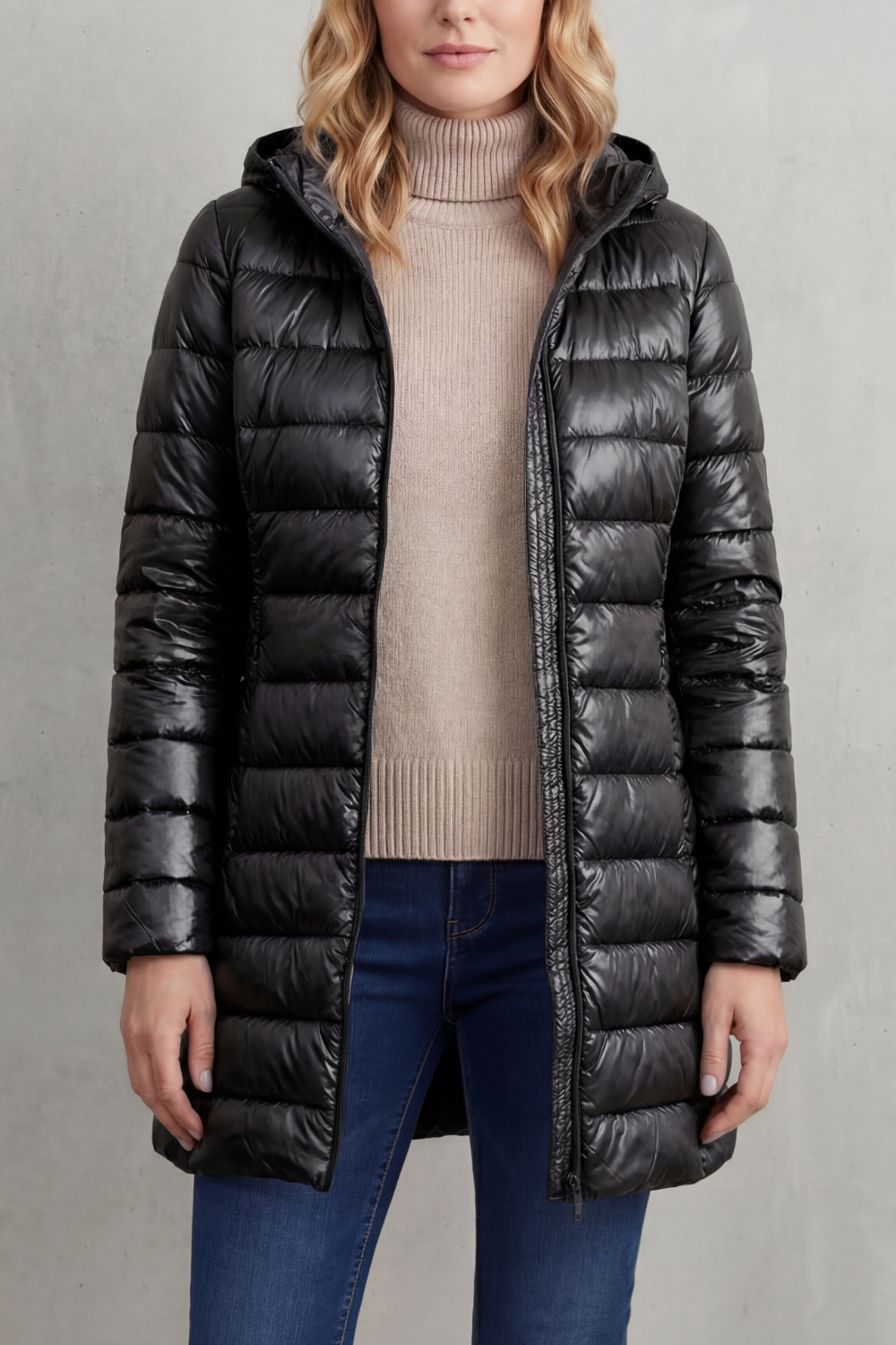 Black longline hooded puffer jacket shown open, featuring a glossy finish, quilted panels, and extended length.