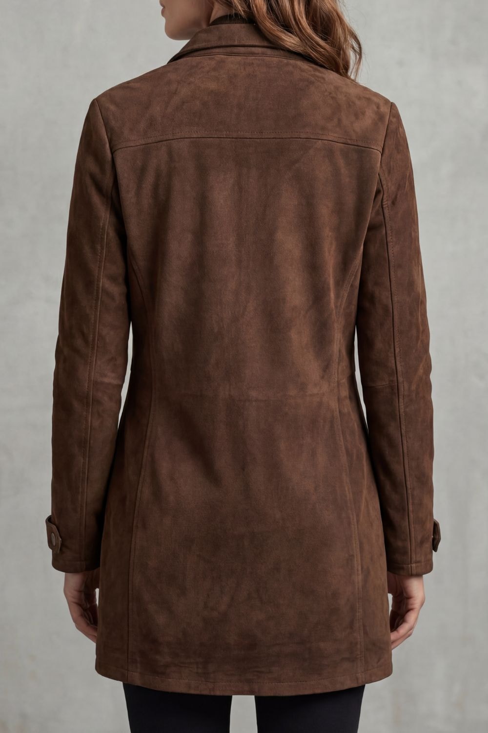 Back view of the brown longline utility coat showing the smooth rear panel, structured shoulder seam, long sleeves, and cuff tabs.