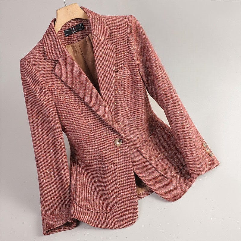 A tailored speckled blazer with notched lapels, a single button front, and front patch pockets displayed on a hanger._0