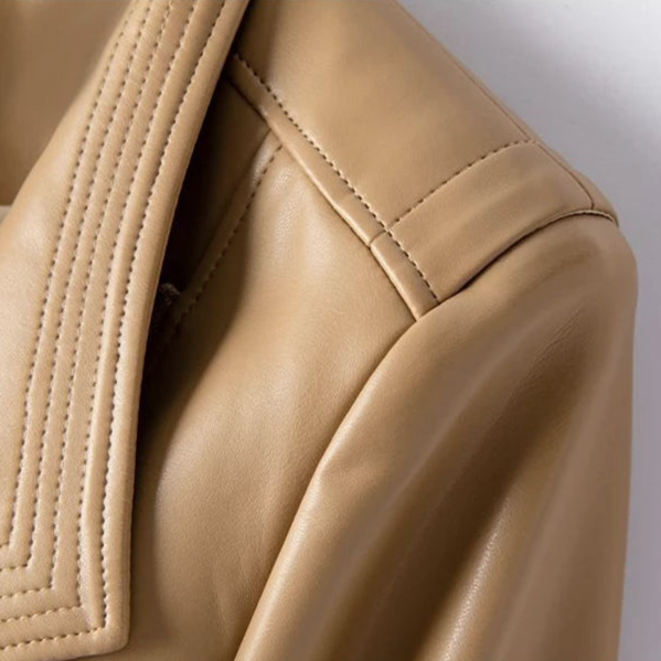 A women's moto-style jacket with a structured collar and asymmetrical front zip displayed on a wooden hanger._7