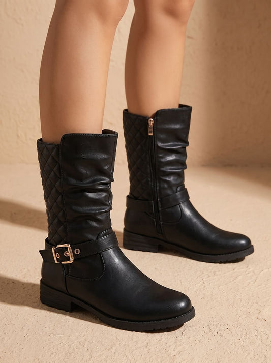 Pair of black mid-calf slouch boots with quilted shaft panels, ankle buckles, side zippers, and low heels.