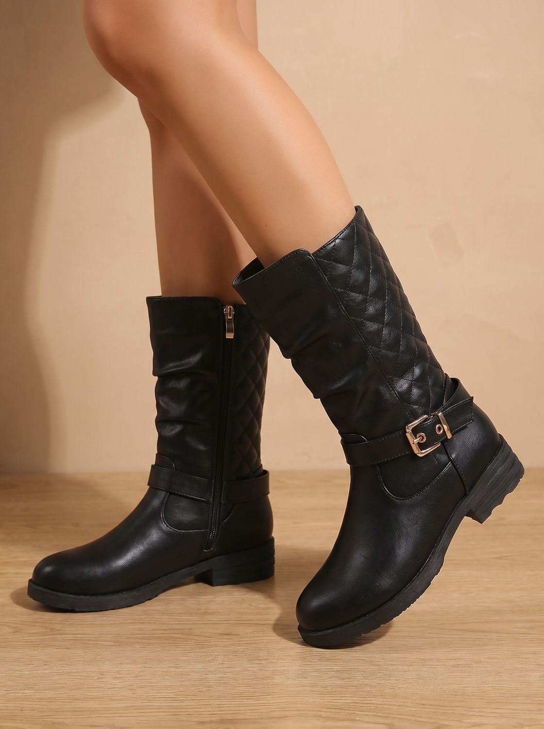 Black mid-calf boots viewed from the opposite side, emphasizing the side zipper, quilted shaft, and low block heels.