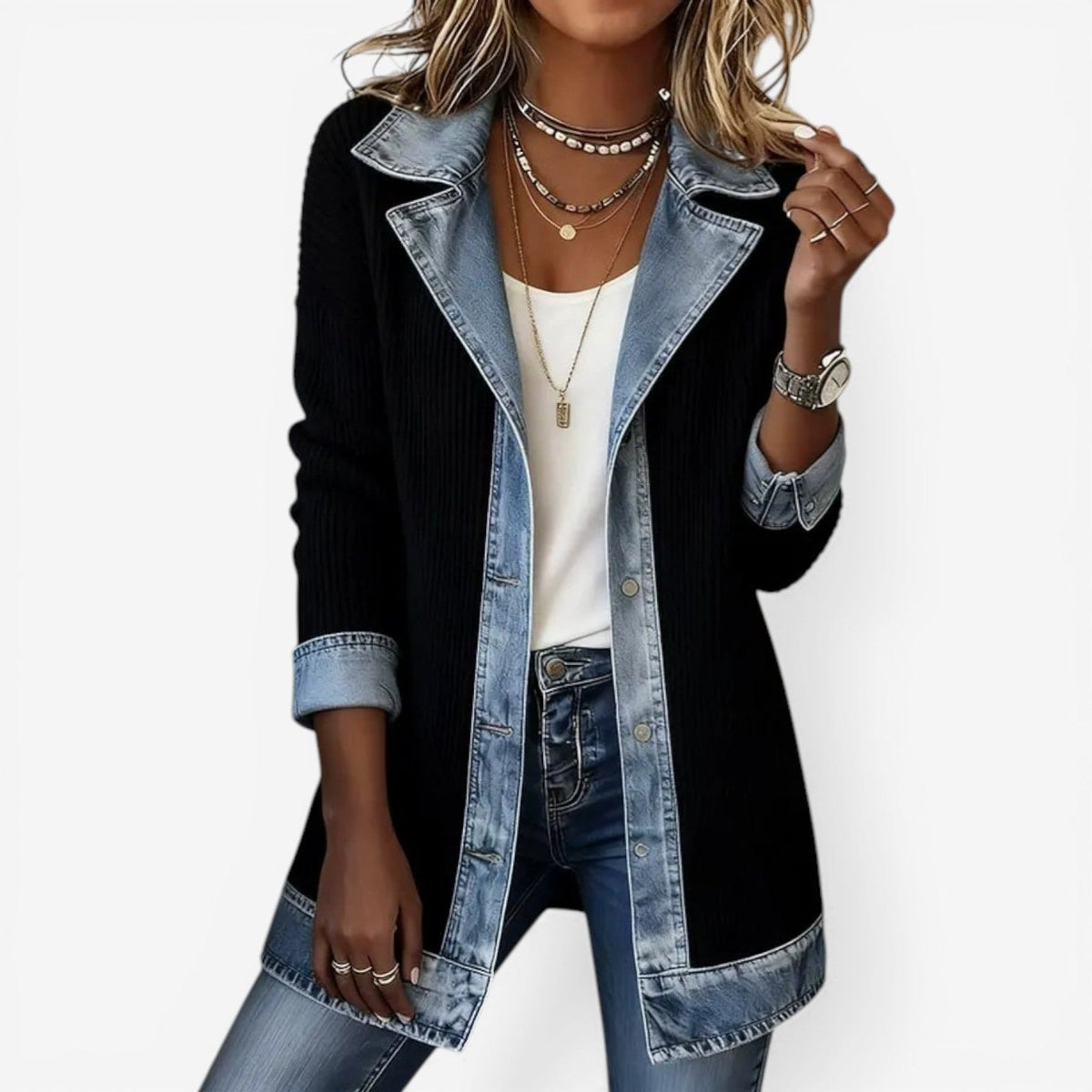 Black longline collared jacket featuring contrasting denim-look lapels, button placket, hem, and rolled cuffs.