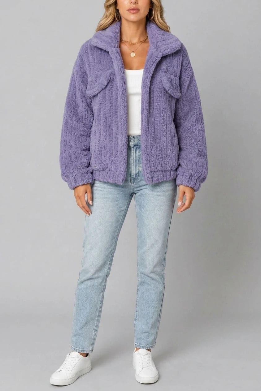 Cropped textured fleece jacket with wide collar, open front, chest flap pockets and elasticated cuffs, worn over a tank top with straight leg jeans and white trainers._0
