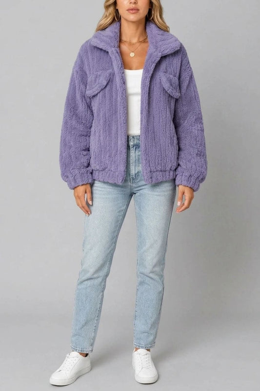 Cropped textured fleece jacket with wide collar, open front, chest flap pockets and elasticated cuffs, worn over a tank top with straight leg jeans and white trainers._0