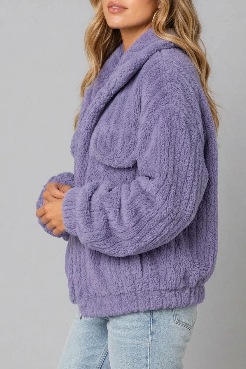 Cropped textured fleece jacket with wide collar, open front, chest flap pockets and elasticated cuffs, worn over a tank top with straight leg jeans and white trainers._1