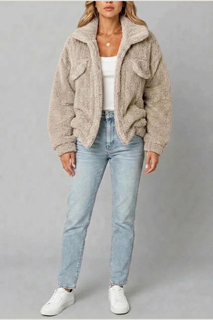 Cropped textured fleece jacket with wide collar, open front, chest flap pockets and elasticated cuffs, worn over a tank top with straight leg jeans and white trainers._12