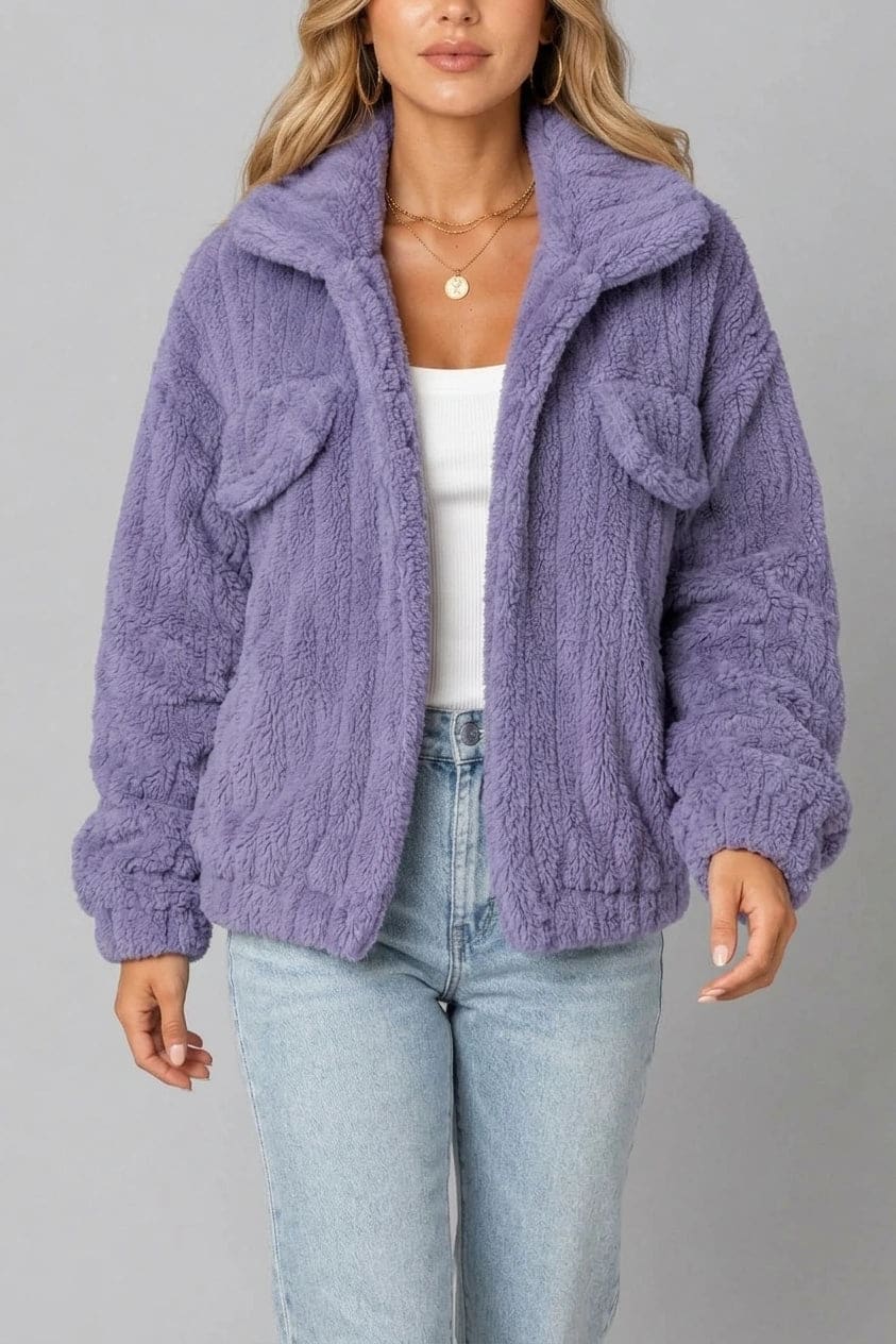 Cropped textured fleece jacket with wide collar, open front, chest flap pockets and elasticated cuffs, worn over a tank top with straight leg jeans and white trainers._2