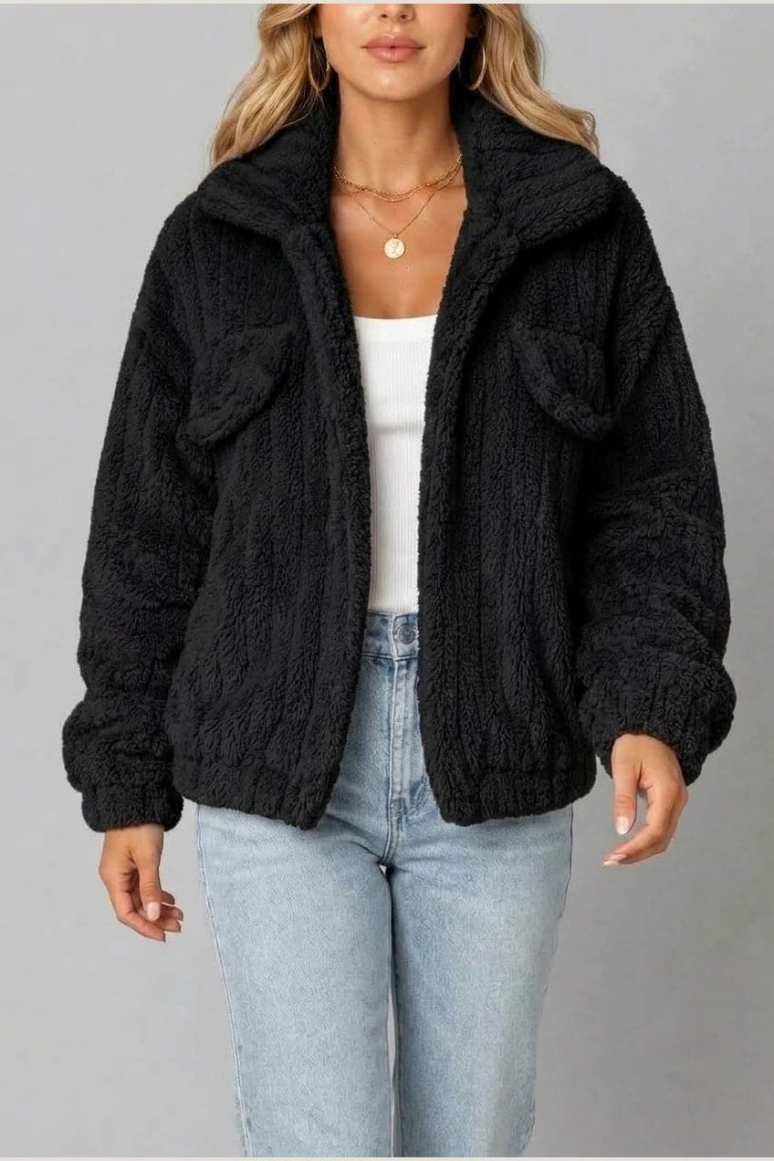 Cropped textured fleece jacket with wide collar, open front, chest flap pockets and elasticated cuffs, worn over a tank top with straight leg jeans and white trainers._20