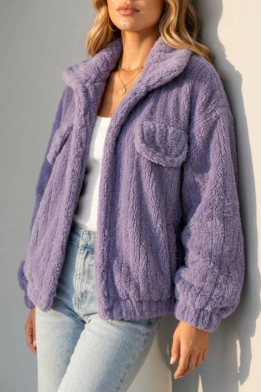 Cropped textured fleece jacket with wide collar, open front, chest flap pockets and elasticated cuffs, worn over a tank top with straight leg jeans and white trainers._3